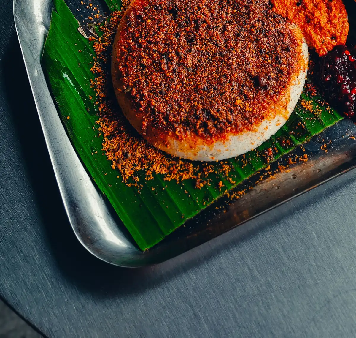 Idlies tossed in molaga podi and ghee, a signature South Indian preparation